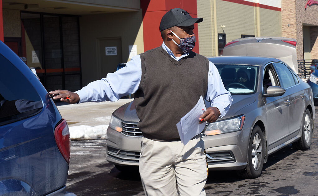 Pastor Tim Fugate directs cars